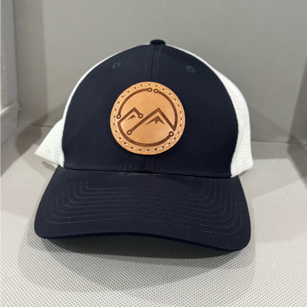 Black and White Trucker Hat with Leather Mountain Patch